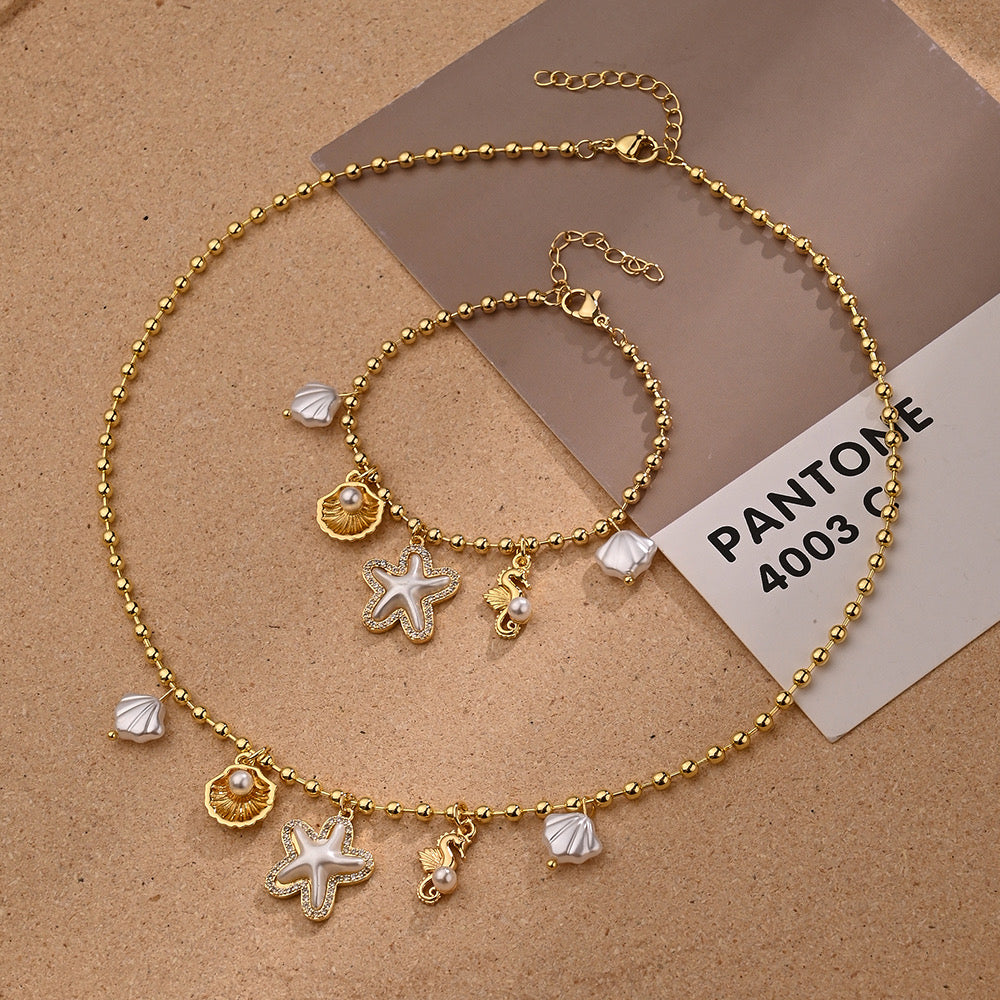 Set Collar y Pulsera con Dijes Marinos Dorados
