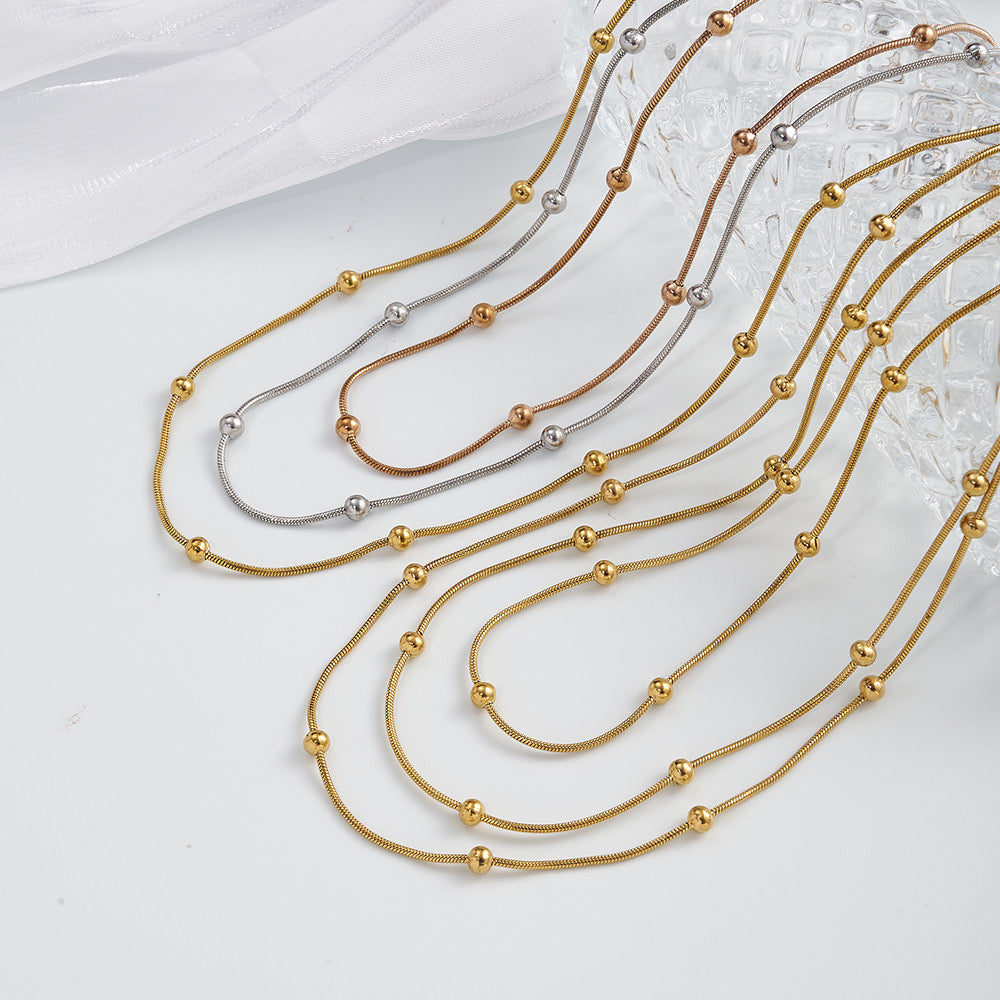 Collar de 3 Caídas con Bolitas – Dorado y Tricolor
