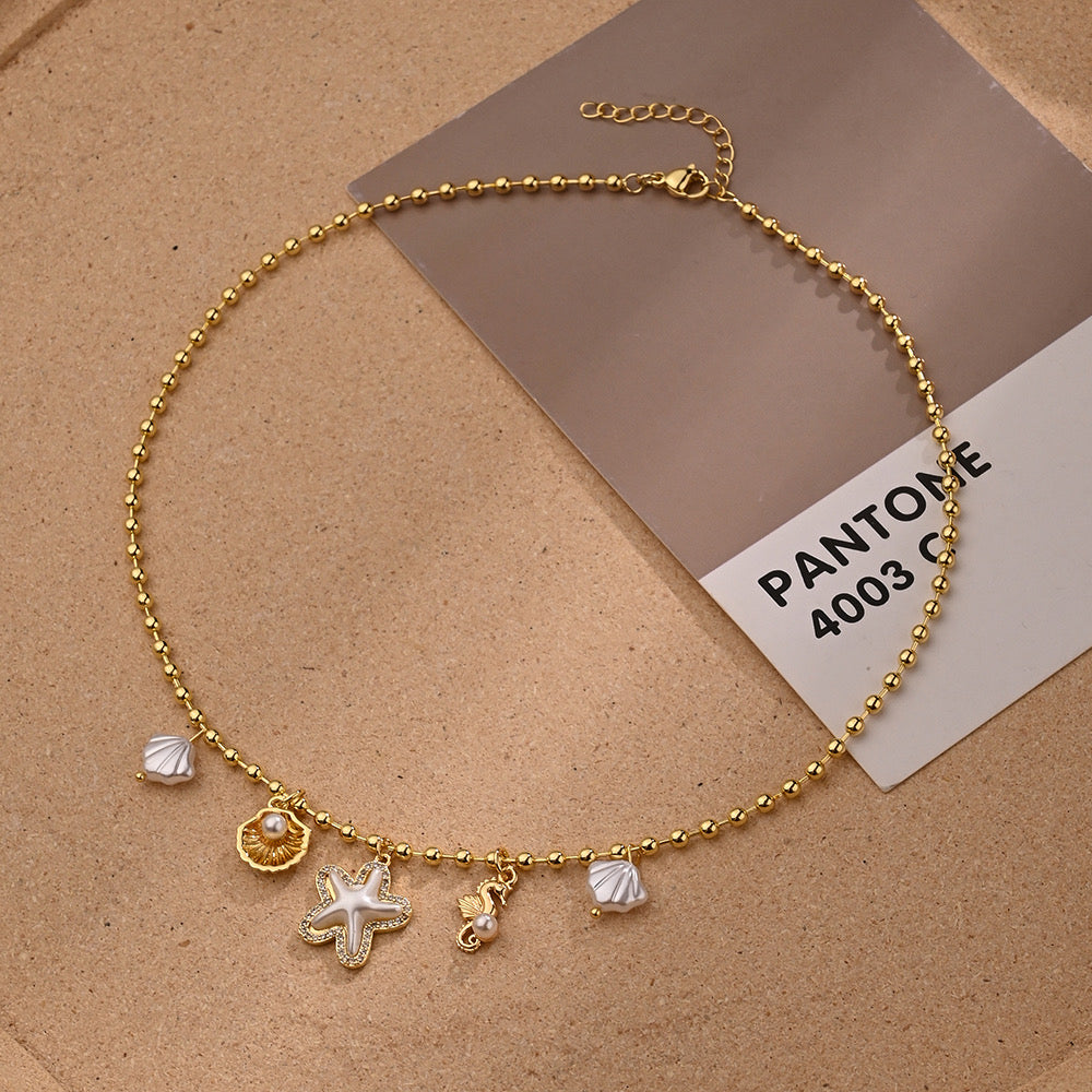 Set Collar y Pulsera con Dijes Marinos Dorados