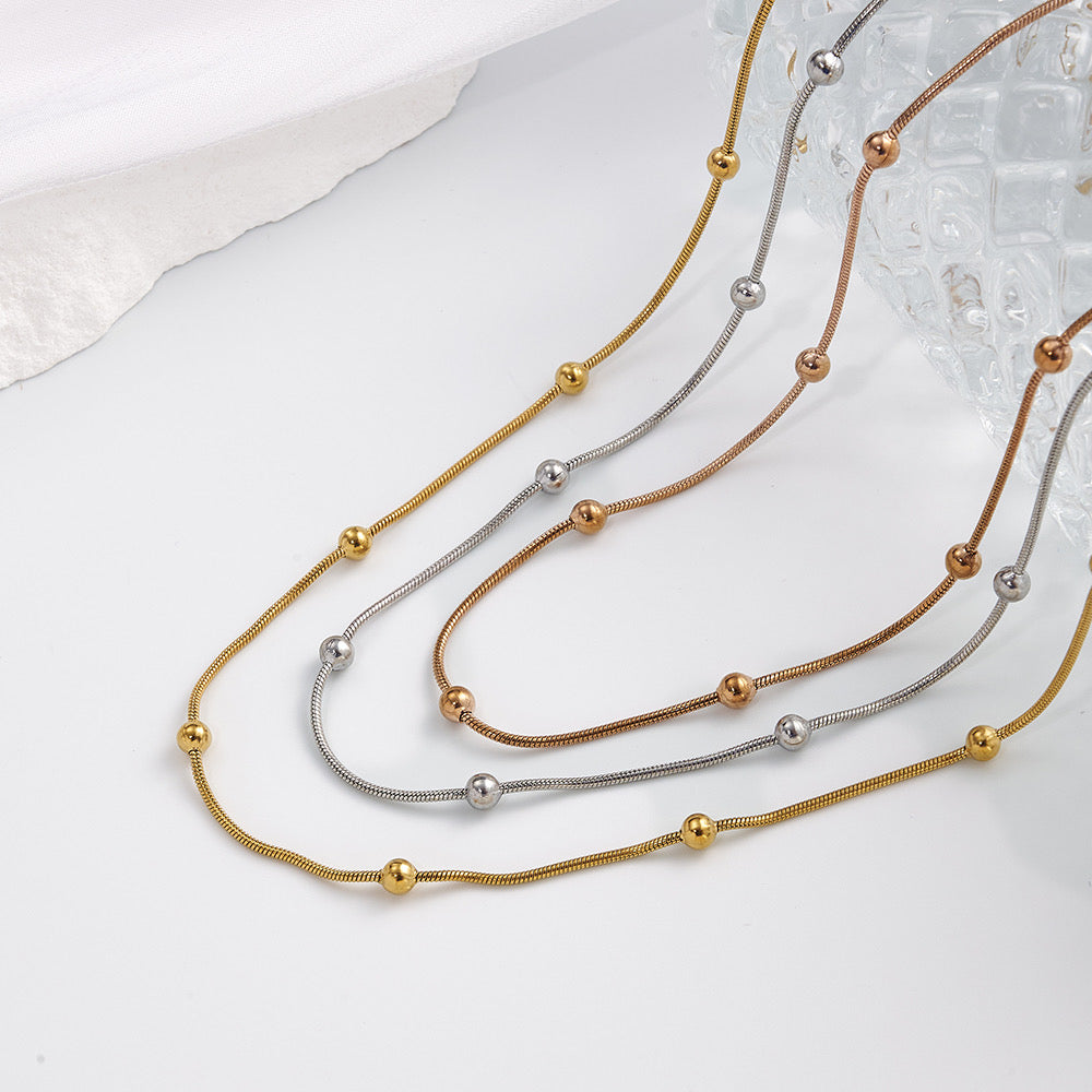 Collar de 3 Caídas con Bolitas – Dorado y Tricolor