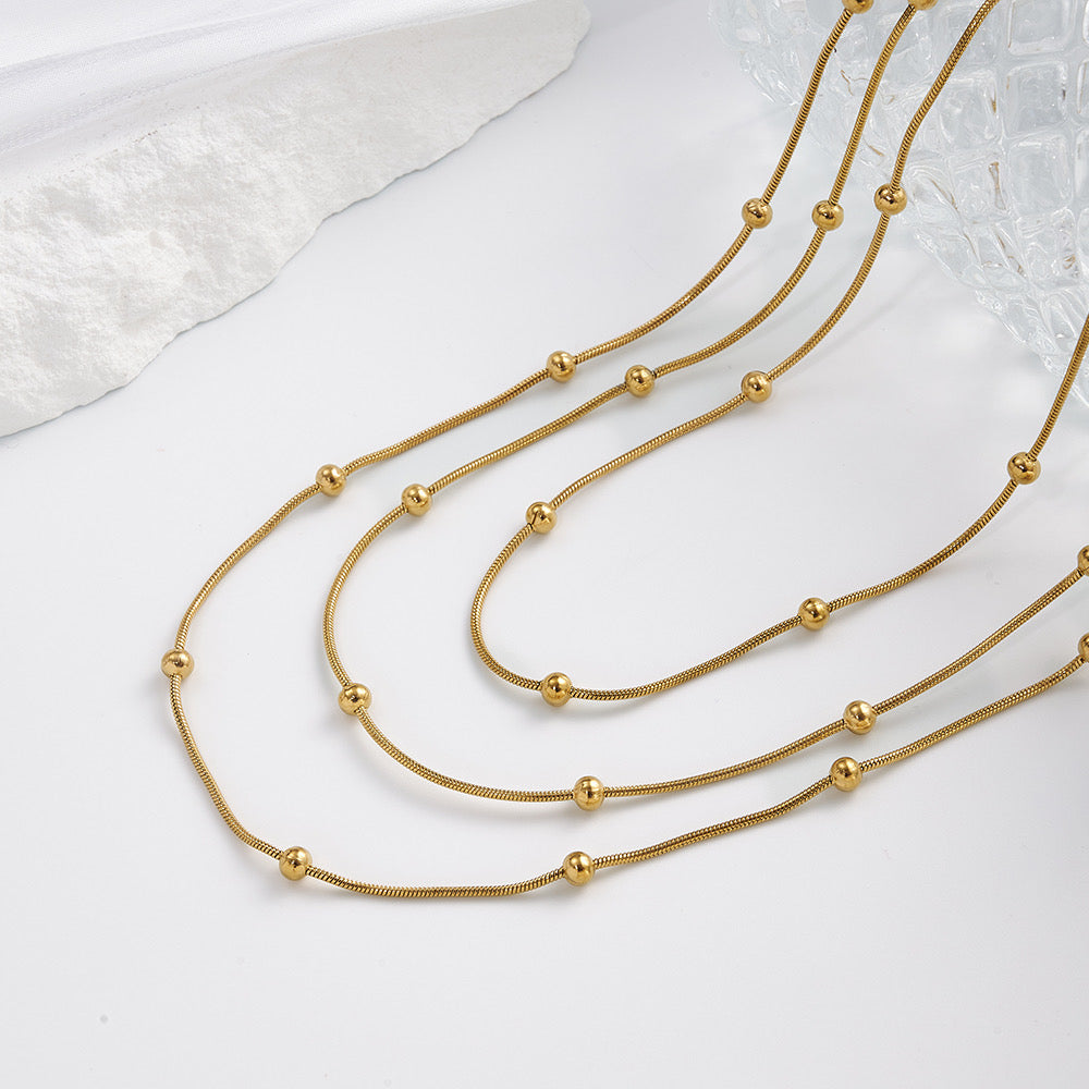 Collar de 3 Caídas con Bolitas – Dorado y Tricolor