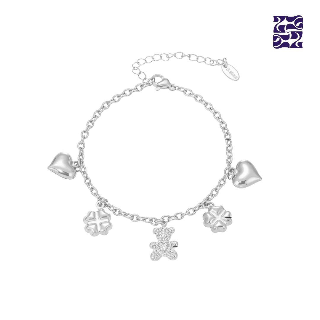 Pulsera con Dijes de Osito, Corazón y Trébol – Oro y Plata
