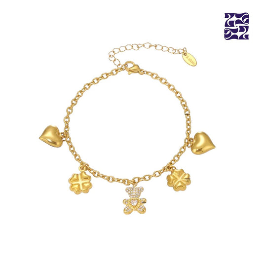 Pulsera con Dijes de Osito, Corazón y Trébol – Oro y Plata